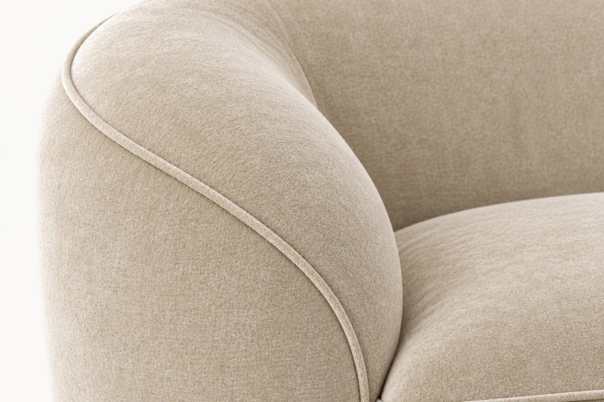 Close-up detail of the Brera tuxedo sofa's arm, highlighting the contrast piping along the tailored edge.