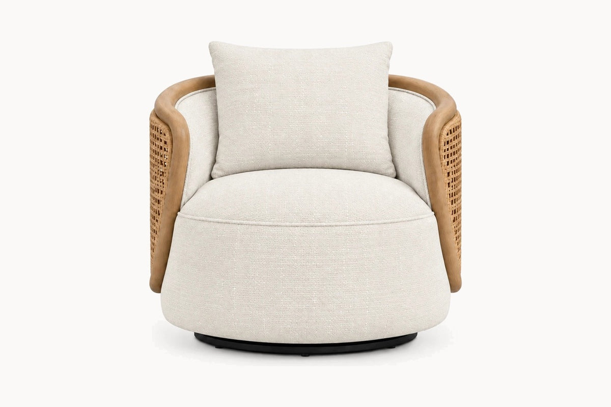 A modern barrel-style swivel armchair with a round off-white textured fabric seat and back cushion, natural woven cane side panels, and a black circular base, shown against a plain white background.