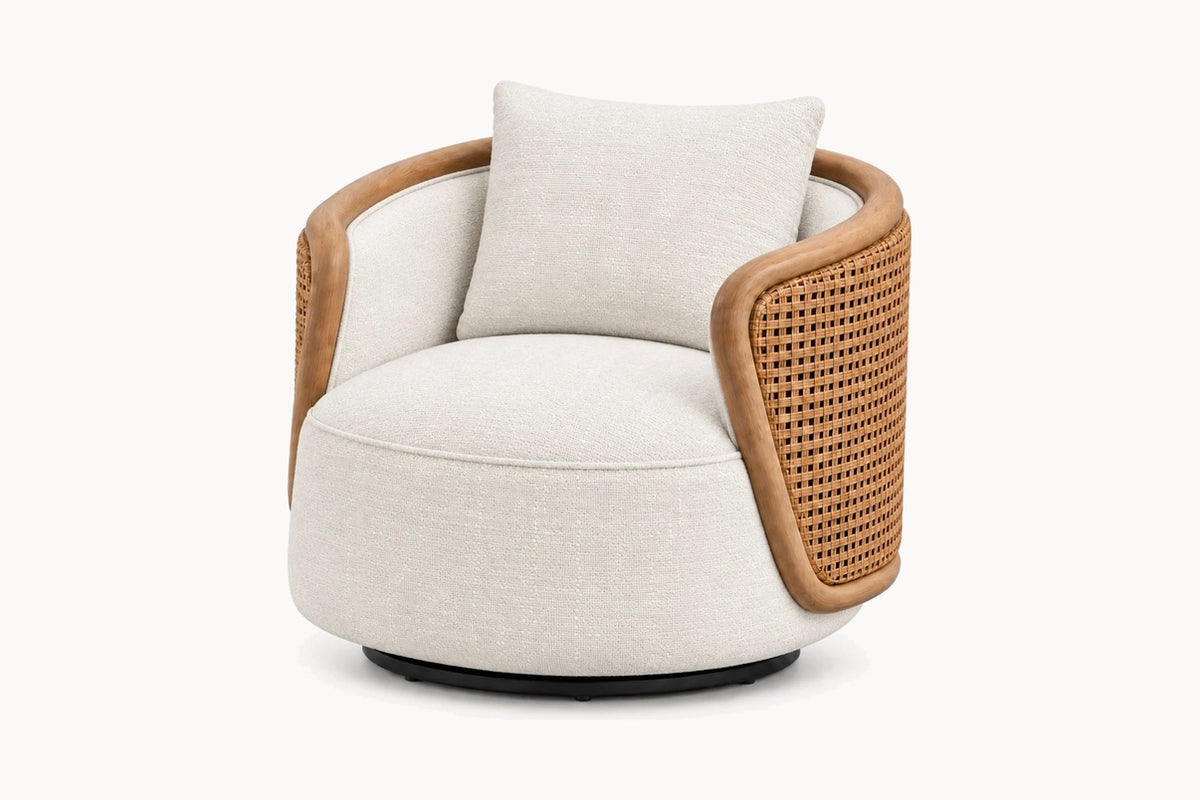 A modern barrel-style accent chair with a round off-white fabric seat and back cushion, a natural woven cane armrest, and a light wood frame, shown on a plain white background.