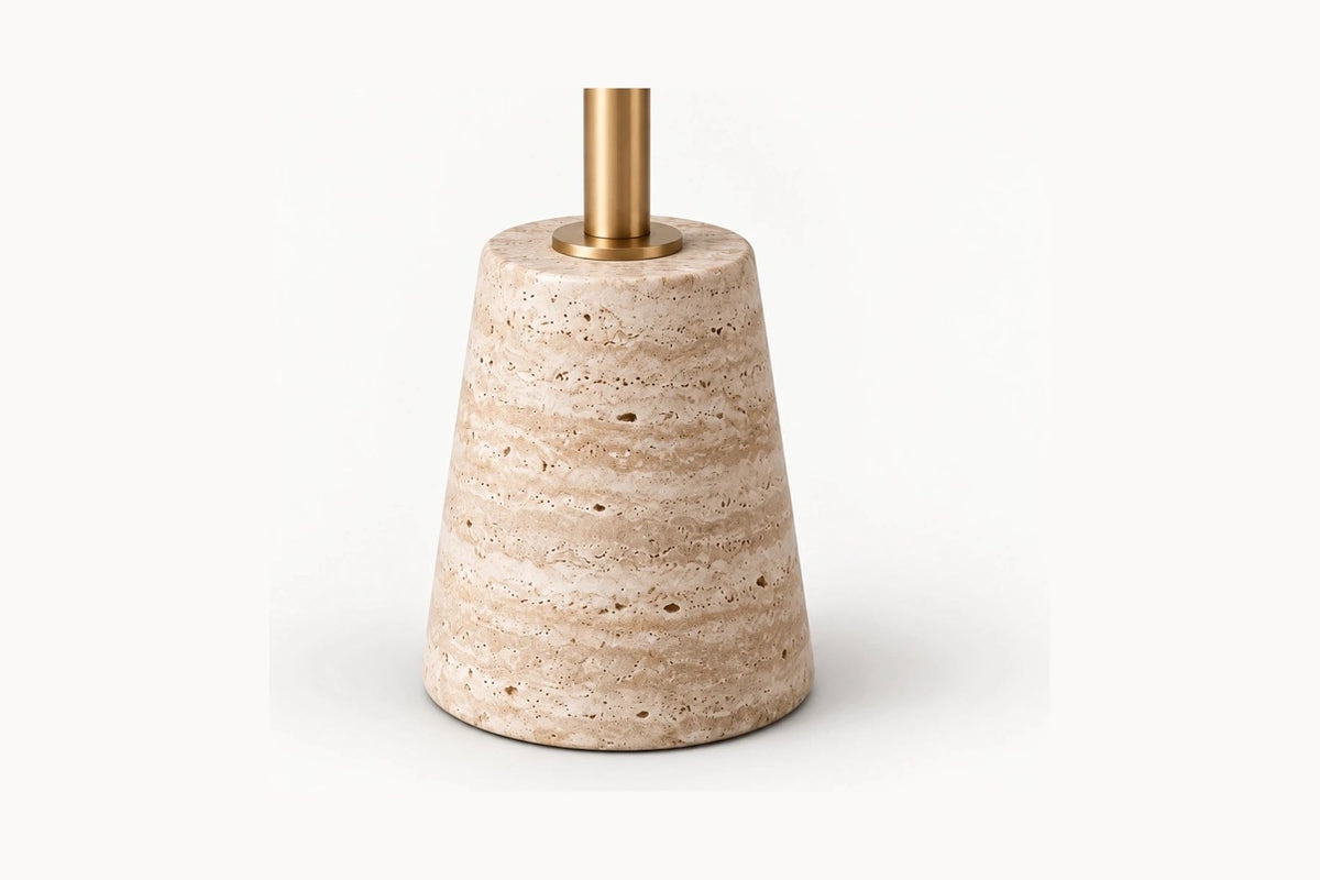 Ostia Pedestal Side Table, close view of the honed travertine edge above the brass reveal